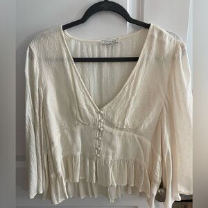 Cream bohemian blouse with flowy sleeves